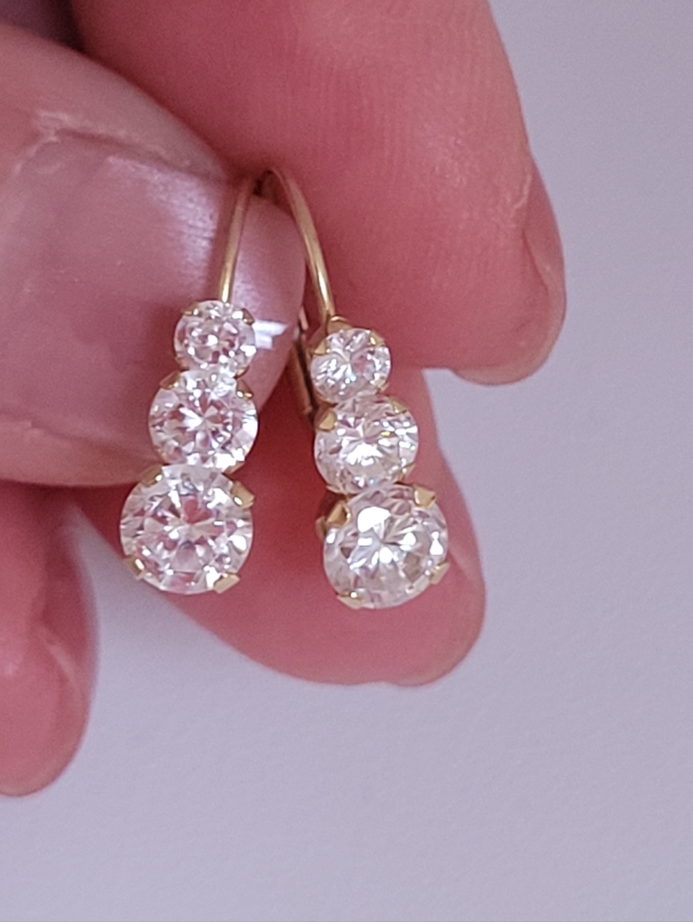 14k Solid Yellow Gold Triple Cubic Zirconia Leverback Earrings.